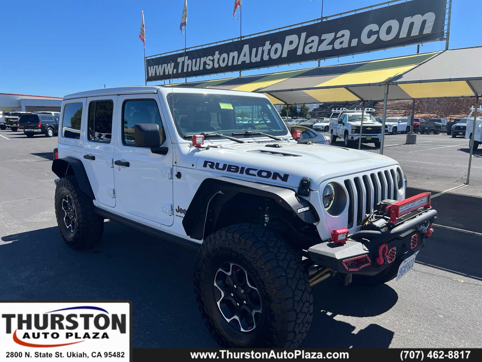 2023 Jeep Wrangler Rubicon in White — front three-quarter view