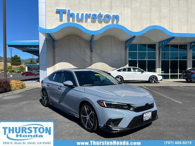 2024 Honda Civic Sedan Touring CVT in Sonic Gray Pearl — front three-quarter view