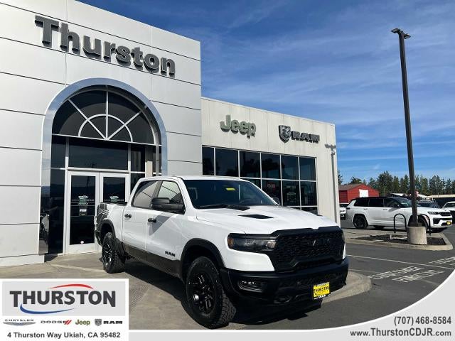 2025 RAM 1500 Rebel 4x4 Crew Cab 5'7" Box in Bright White Clearcoat — front three-quarter view
