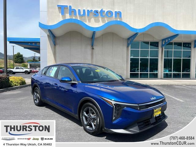 2025 Kia K4 LXS FWD in Deep Sea Blue — front three-quarter view